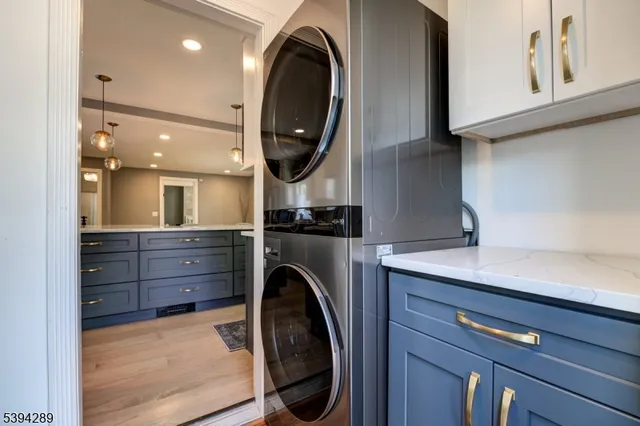 a kitchen with a sink a washer and dryer