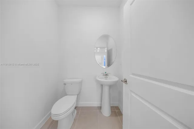 a bathroom with a toilet and a sink