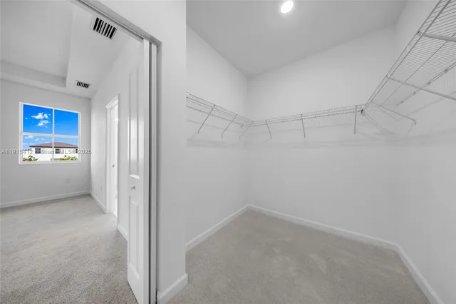 a bathroom with a shower sink and mirror