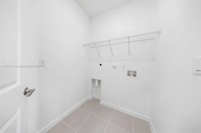 a view of an empty room and a window