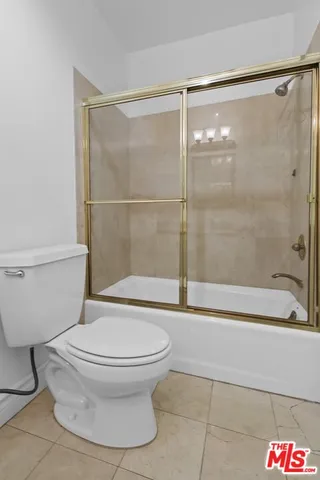 a bathroom with a sink vanity and mirror
