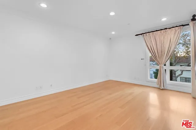 a bathroom with a tub a sink and a mirror