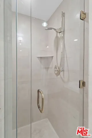 a bathroom with a sink mirror and vanity