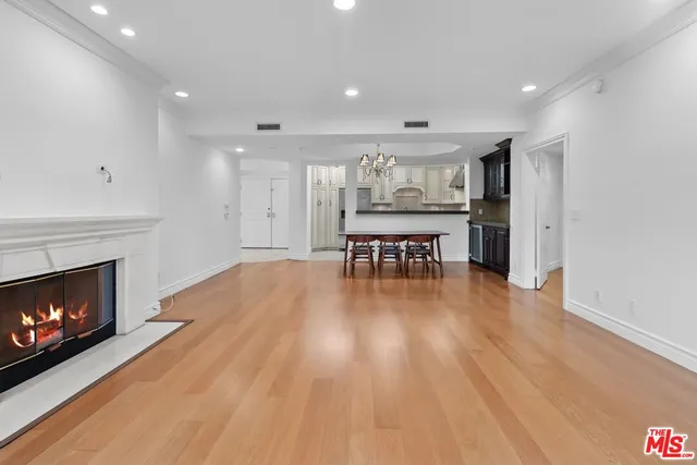 a view of kitchen with cabinets and wooden floor