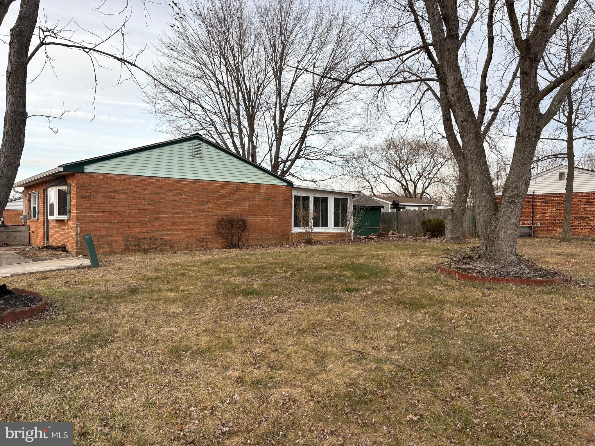 7 Poe Way Newark, DE 19702 - Photo 8 of 10 a backyard of a house with large trees