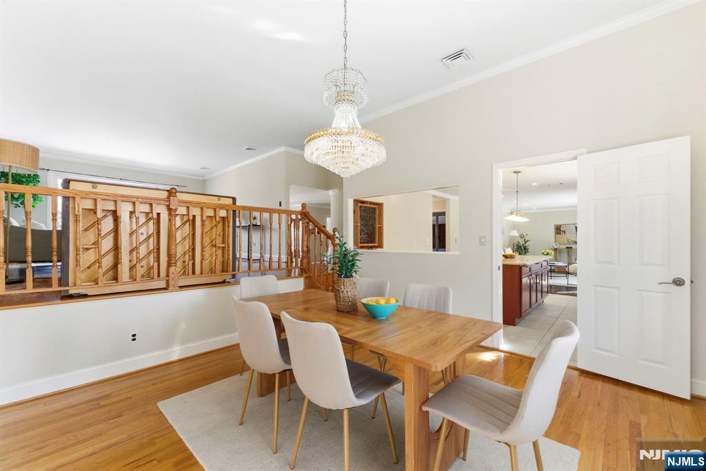 3 Rutgers Court Roseland, NJ 07068 - Photo 11 of 29 a view of a dining room with furniture and wooden floor