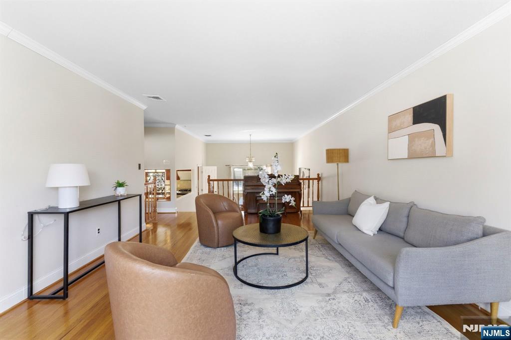 3 Rutgers Court Roseland, NJ 07068 - Photo 15 of 29 a living room with furniture and kitchen view