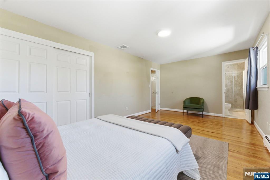 3 Rutgers Court Roseland, NJ 07068 - Photo 23 of 29 a bedroom with a bed and a dresser
