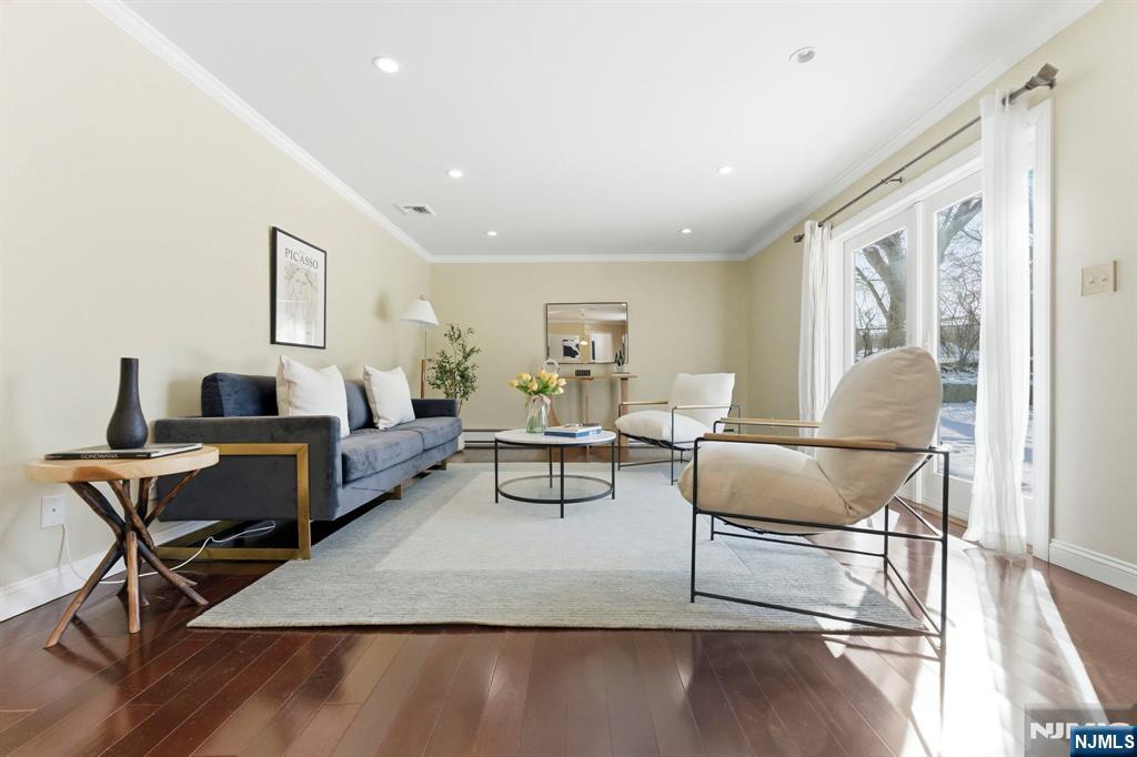 3 Rutgers Court Roseland, NJ 07068 - Photo 4 of 29 a living room with furniture and a wooden floor