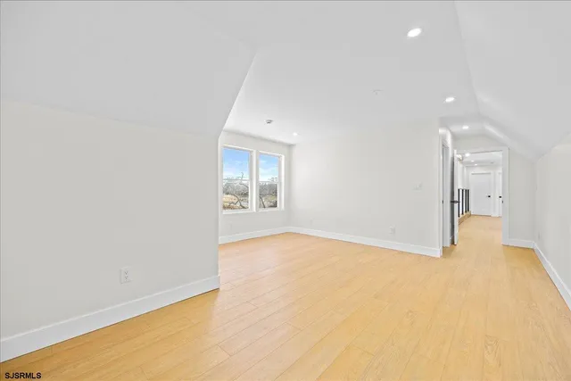an aerial view of residential building and lake
