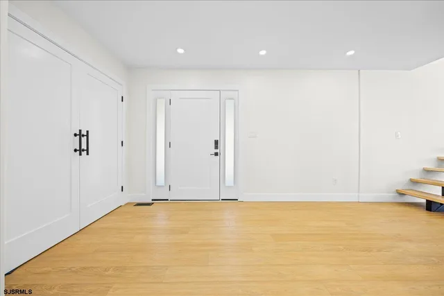 a kitchen with stainless steel appliances granite countertop a sink a stove and a kitchen island with a sink