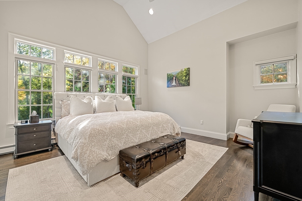 120 Deerfield Lane Hanover, MA 02339 - Photo 23 of 42 a bed sitting in a bedroom next to a window