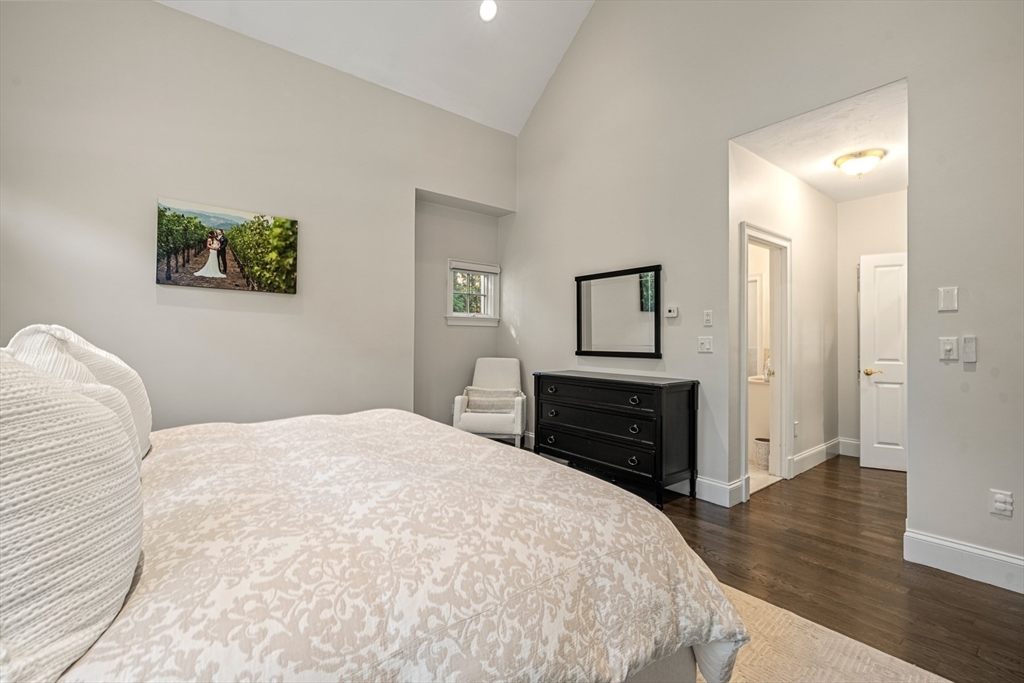 120 Deerfield Lane Hanover, MA 02339 - Photo 24 of 42 a bedroom with a bed and a dresser
