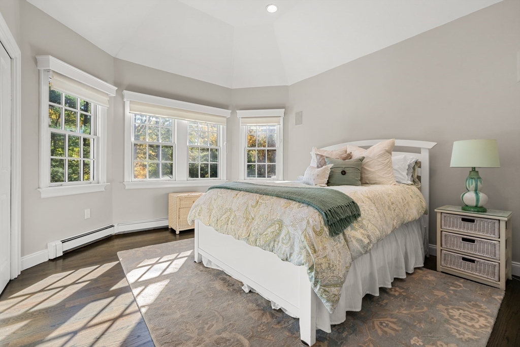 120 Deerfield Lane Hanover, MA 02339 - Photo 33 of 42 a spacious bedroom with a bed and a window