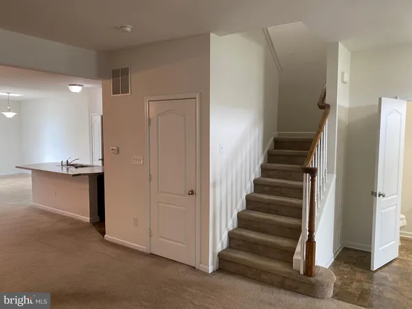 a view of an entryway with stairs