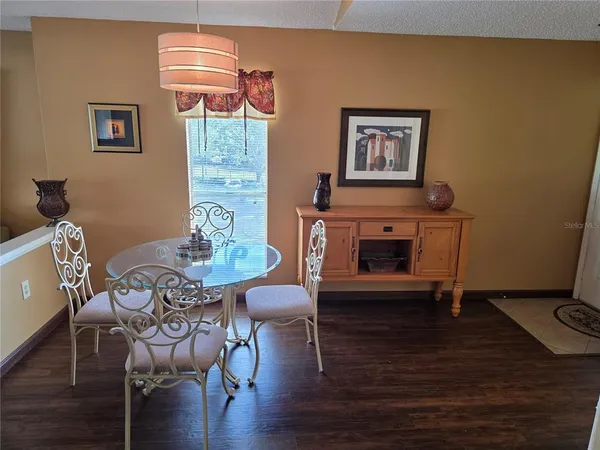 a view of dining room with wooden floor