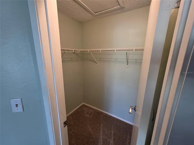 a bed room with a bed and a night stand