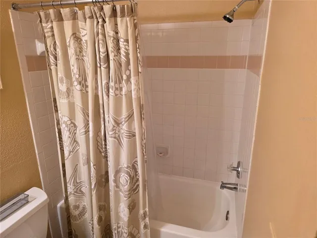 a living room with furniture a couch and a window