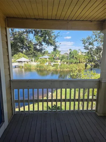 a view of a lake with houses in the back
