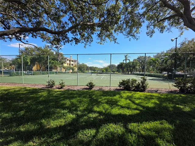 a park view with a fountain space and swimming pool