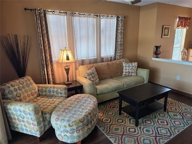 a kitchen with white cabinets and appliances