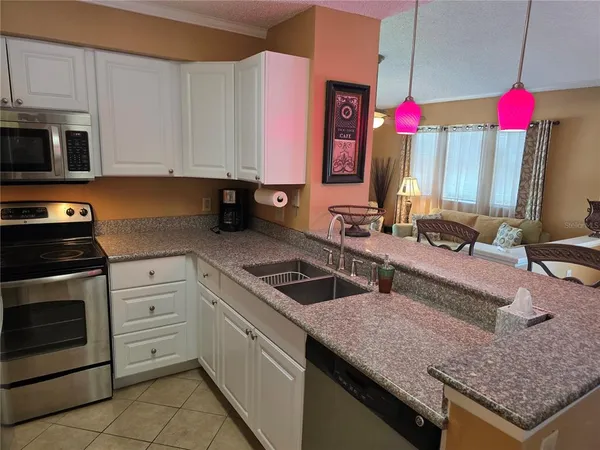 a kitchen with a table and chairs