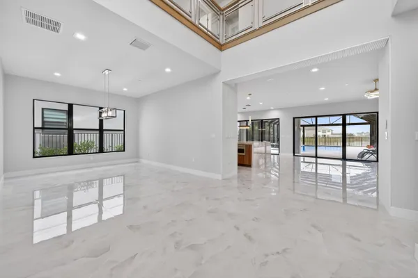 a large kitchen with stainless steel appliances granite countertop a large stove top oven and cabinets