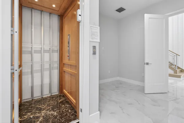 a large kitchen with stainless steel appliances lots of counter top space