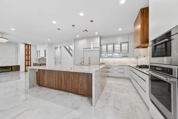 a view of a livingroom with an empty space and a fireplace