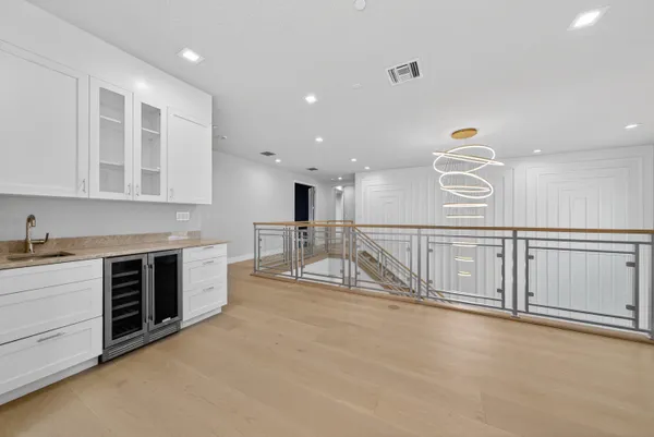 a living room with a bed and a table