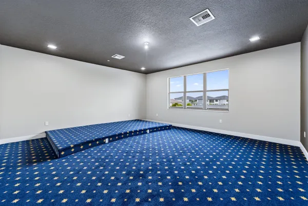 an aerial view of residential houses with yard