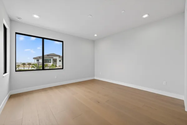 an aerial view of residential houses with outdoor space and swimming pool
