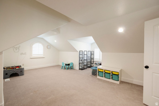 924 Country Lane Farmington, UT 84025 - Photo 43 of 91 Spacious room featuring vaulted ceilings, neutral carpeting, and white walls