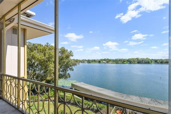a view of a lake with houses in the back