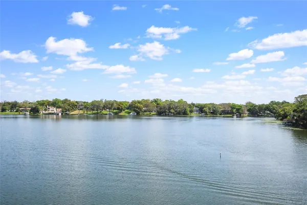 a living room with furniture tv and large window