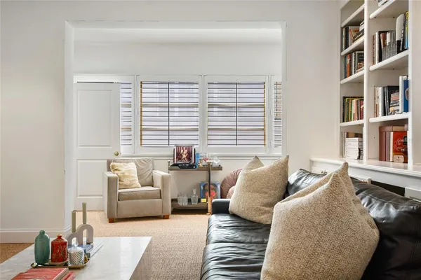 a bathroom with a granite countertop sink a toilet and a mirror