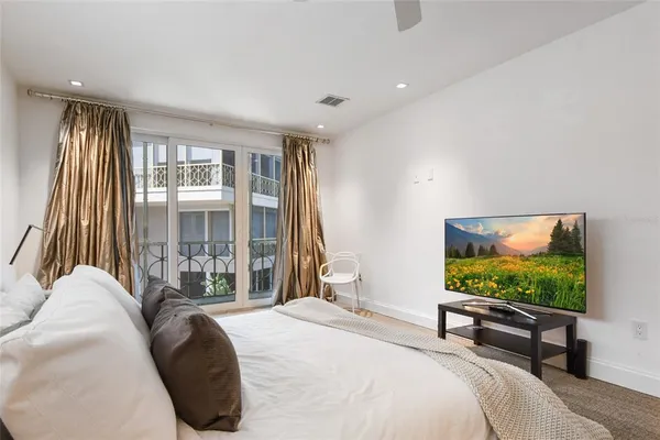 a bathroom with a granite countertop sink a toilet and shower