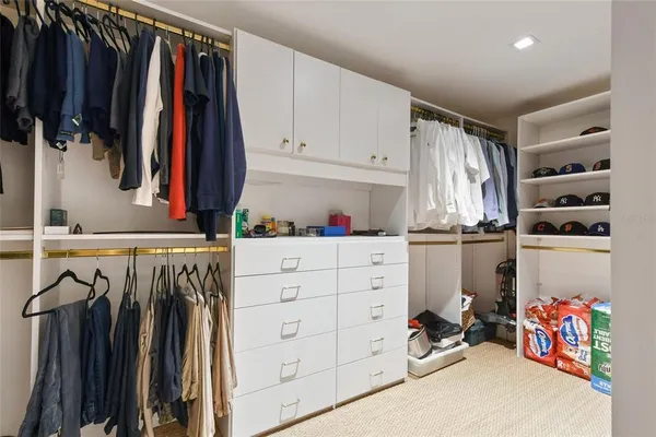 a view of a building with sitting area and furniture