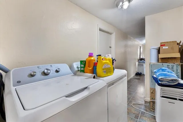 a utility room with dryer and washer