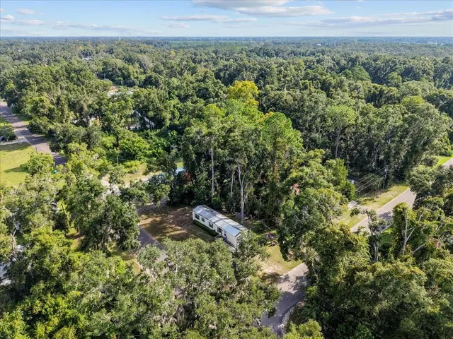 a view of a yard with an outdoor space