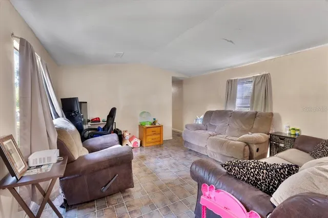 a living room with furniture and a couch