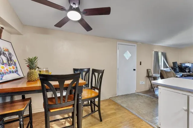 a view of a dining room with furniture and a chandelier