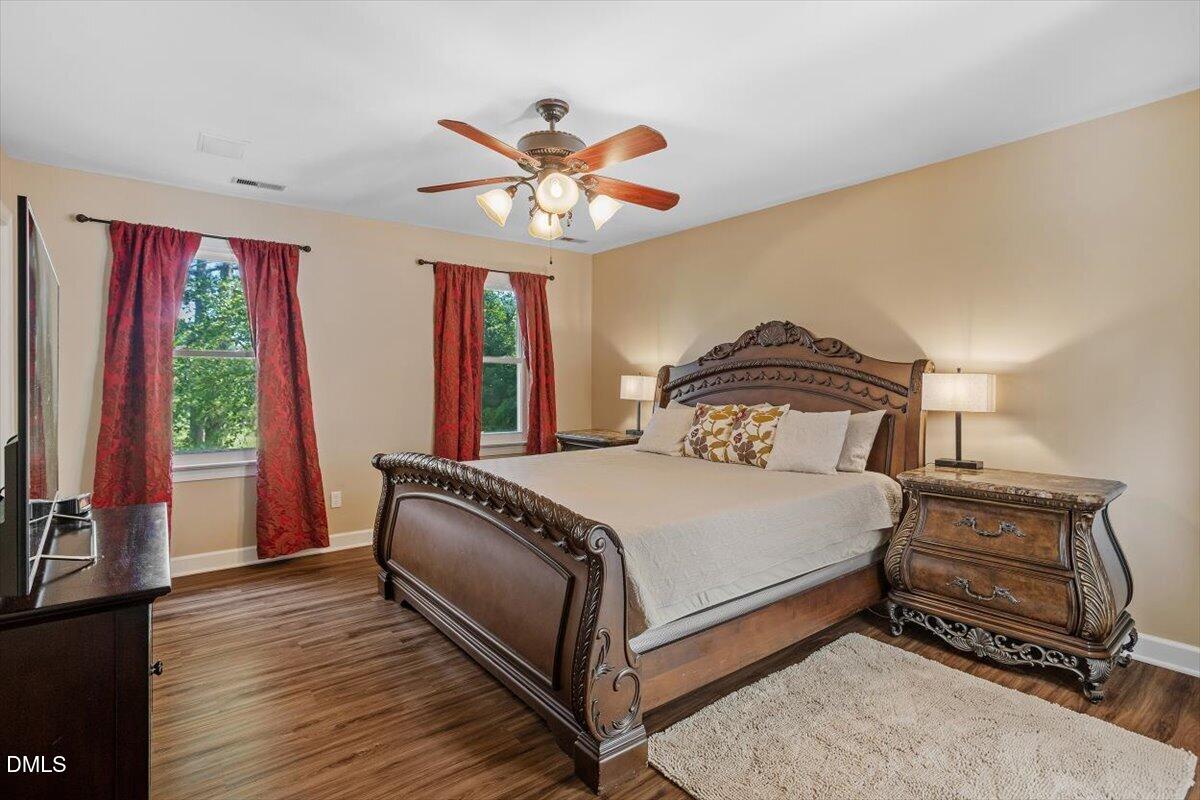 1468 Frazier Road Spring Hope, NC 27882 - Photo 18 of 71 a bedroom with a bed and wooden floor
