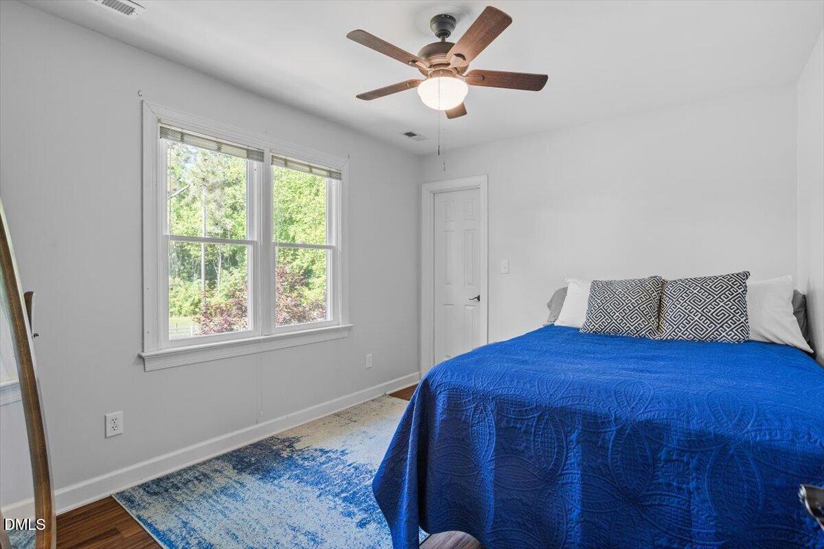 1468 Frazier Road Spring Hope, NC 27882 - Photo 23 of 71 a bedroom with a bed and a window