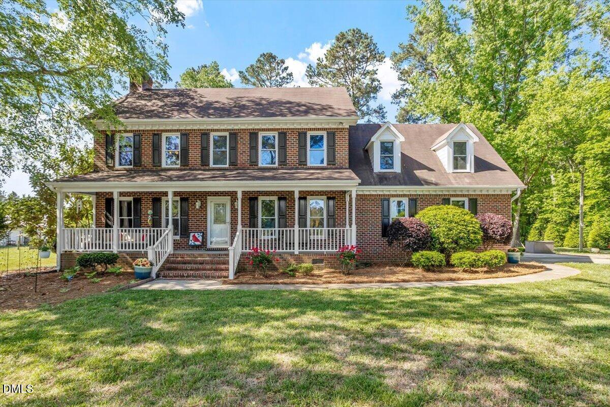 1468 Frazier Road Spring Hope, NC 27882 - Photo 2 of 71 a front view of a house with a yard