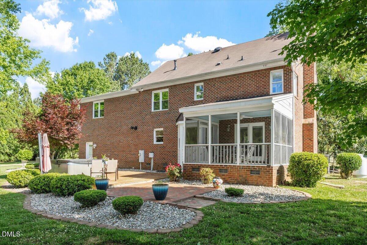 1468 Frazier Road Spring Hope, NC 27882 - Photo 40 of 71 a front view of a house with garden and patio