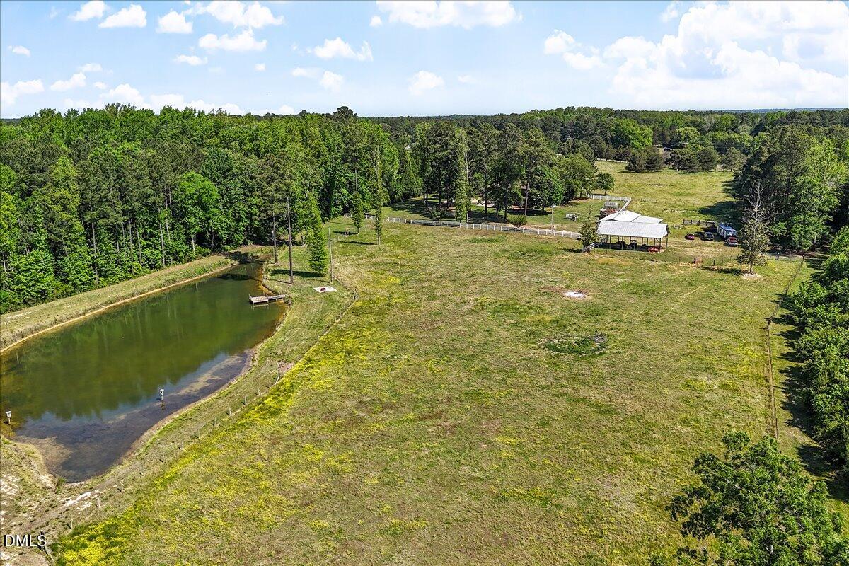 1468 Frazier Road Spring Hope, NC 27882 - Photo 53 of 71 a view of a lake with a yard