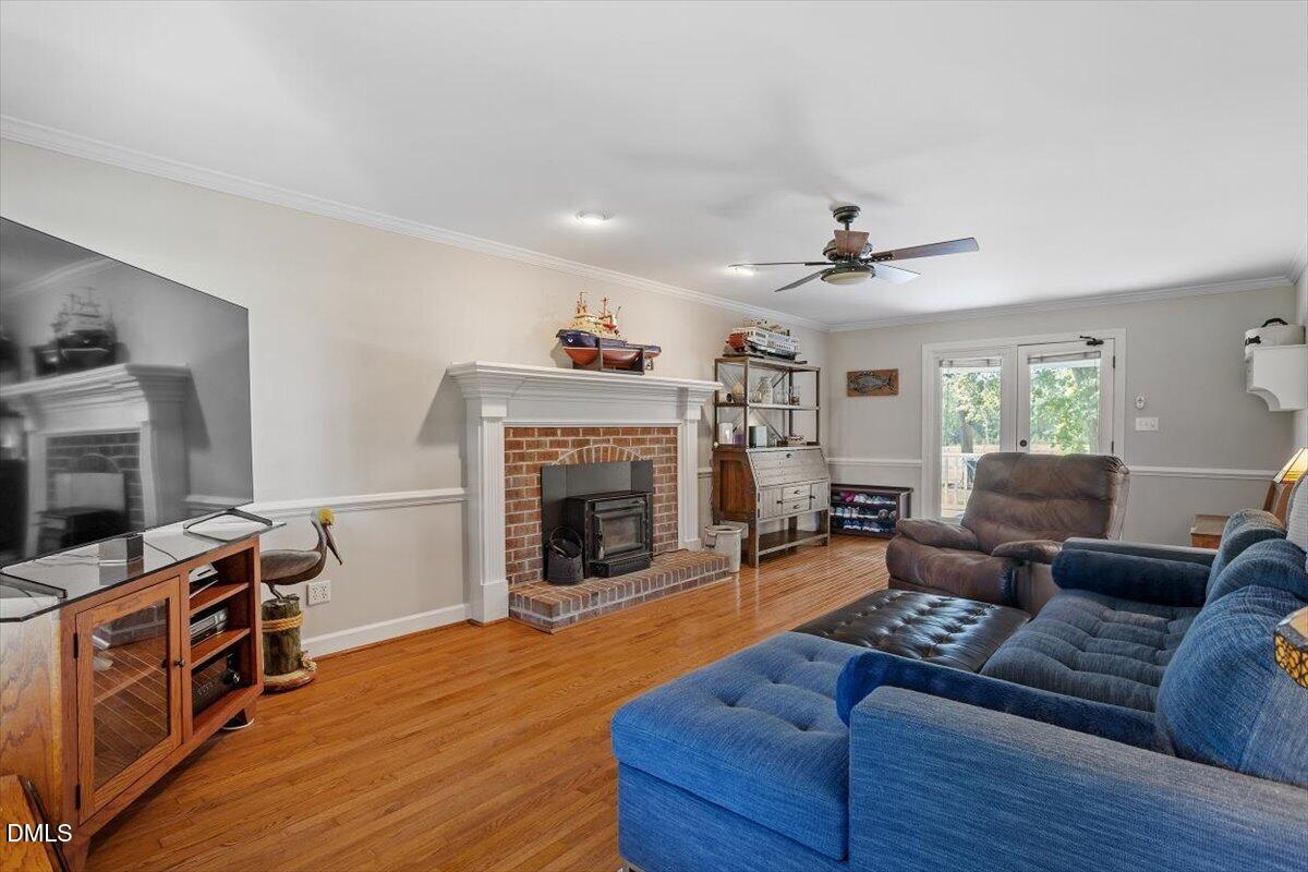 1468 Frazier Road Spring Hope, NC 27882 - Photo 8 of 71 a living room with furniture and a fireplace