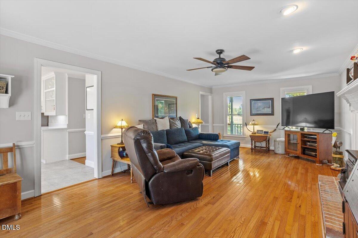 1468 Frazier Road Spring Hope, NC 27882 - Photo 9 of 71 a living room with furniture and a flat screen tv