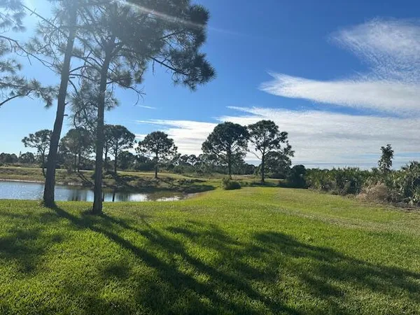 a view of a golf course with a lake